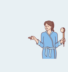 Woman In Bathrobe Holding Shower Brush In Hand