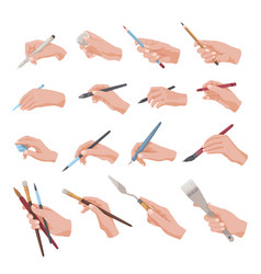 Hands Holding Writing Or Painting Tools