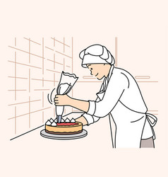 Female Chef Decorating Cake At Restaurant