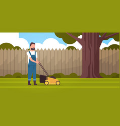 Man Gardener Cutting Green Grass With Lawn Mover