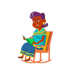 Old Woman Sit In Rocking Chair And Reading