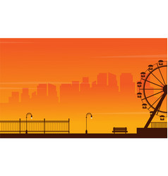 Silhouette Amusement Park At Sunset