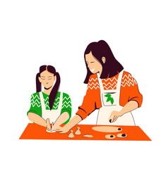 Asian Mother And Daughter Are Cooking Together