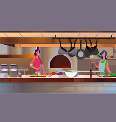 Women Cooking In Restaurant Kitchen