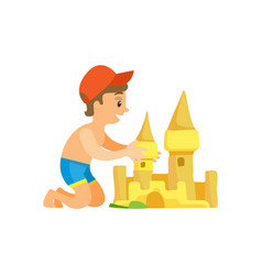 Boy In Swim Trunks And Cap Building Sand Castle