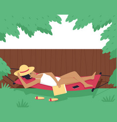 A Woman Sunbathes In Hammock In Yard