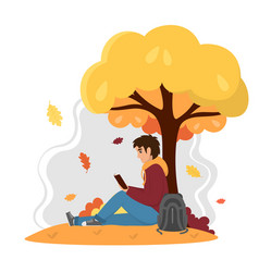 Young Man Reading Book In Autumn