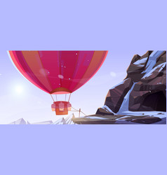 Hot Air Balloon Tied Near Cave In Mountains