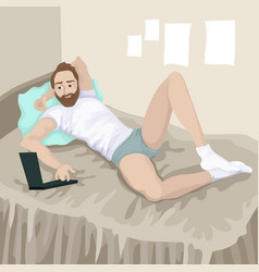 Guy With Laptop Lies In A Bed