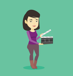 Smiling Woman Holding An Open Clapperboard