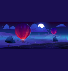 Hot Air Balloons Fly Over Fields At Night