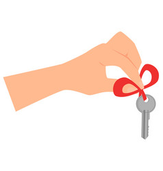 Hand Holding Key That Is Tied With Red Ribbon