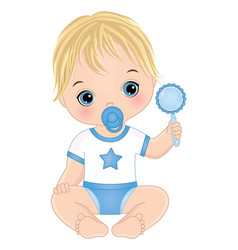 Cute Blond Baby Boy With Pacifier Holding Rattle