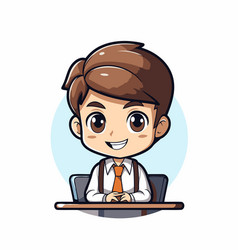 Cute Schoolboy Sitting At Desk And Smiling