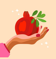 Hand Holding Pomegranate With Leaves