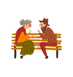 Senior Man And Woman Playing Cards While Sitting