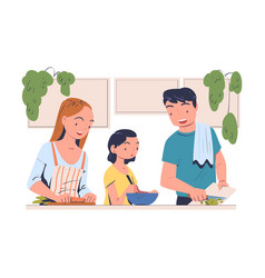 Family In The Kitchen At Table Cooking