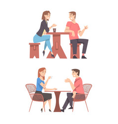 Couple Sitting At Table In Cafe Outdoors Drinking