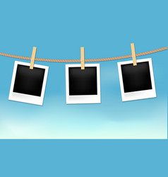 Photo Frames Hanging On Rope With Wood Pins