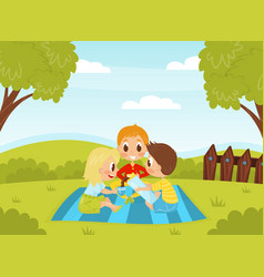 Little Boy And Girl Having Picnic In The Yard