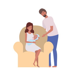 Woman And Man With Newborn Baby Sitting On Sofa