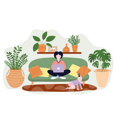 Young Mother Sitting On Sofa With Laptop