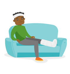 African Man With Broken Leg Sitting On The Couch