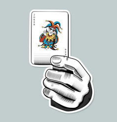 Hand Holding Joker Card