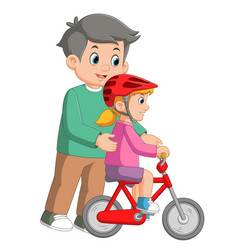 Caring Dad Teaching Daughter To Ride Bike