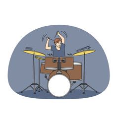 Man Playing On Drum With Sticks