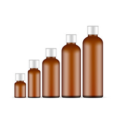 Set Of Amber Plastic Round Bottles Isolated