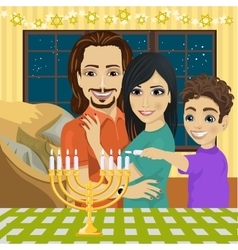 Happy Family Lighting Hanukkah