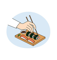 Person Hold Chopsticks Eating Sushi