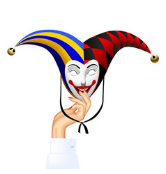 Womans Hand With A Smiled Joker Mask Isolated On