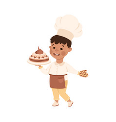 Cheerful Boy In Apron Holding Cake Depicting Chef