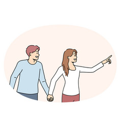 Smiling Woman Holding Man By Hand Pointing Forward