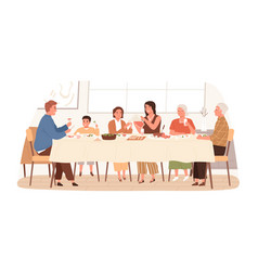 European Family Sitting At Table Together Have