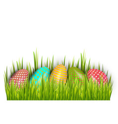 Row Of Easter Painted Eggs Hidden In Green Grass