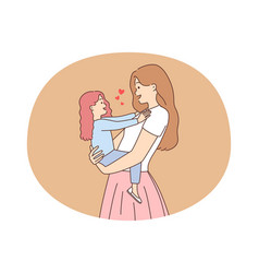 Smiling Mother Holding Small Daughter In Hands