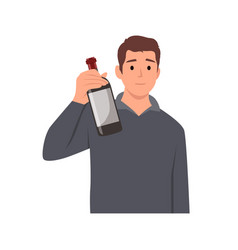 Young Man Standing Holding Bottle Of Wine