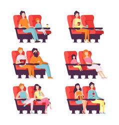 People Sitting In Red Chairs In Cinema Hall