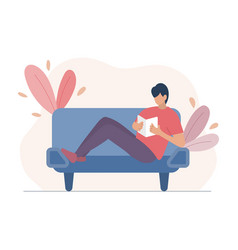 Man Sitting On A Sofa And Reading A Book