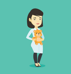 Pediatrician Doctor Holding Teddy Bear