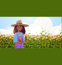 Woman Farmer Holding Corn Cob African American