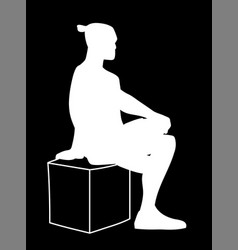 Man Sitting On Box With One Foot Up On Knee