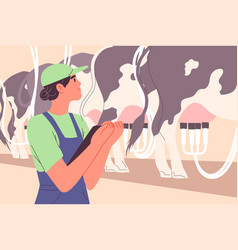 Farm Worker Inspects Automatic Milking Of Cows