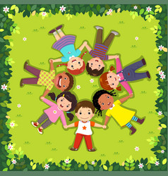 Top View Of Kids Lying On The Grass In A Circle