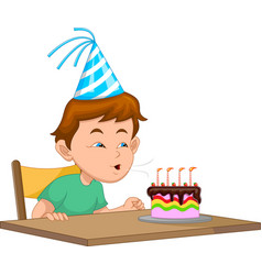 Boy Blowing Out Candles On Birthday Party