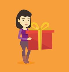 Joyful Asian Woman Holding Box With Gift