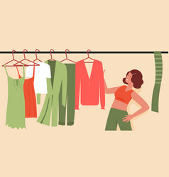 Woman Trying To Choose Outfit Clothes On Wardrobe